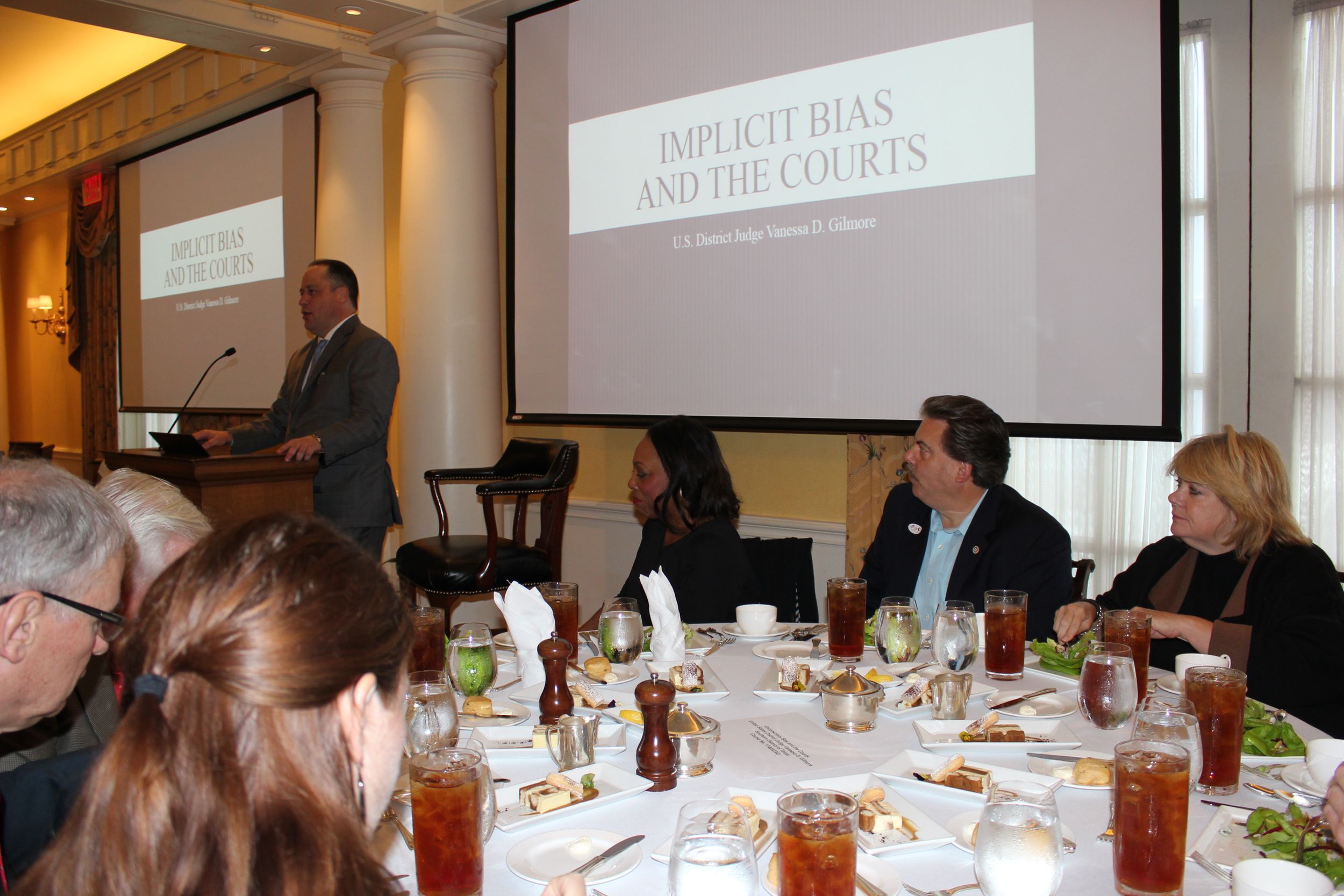 2018-19 Section Chair Andrew Pearce, background left, introduces the guests at the November 1 luncheon to the speaker.